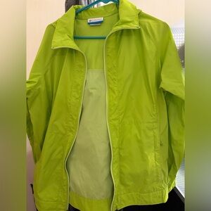Bright green lightweight Columbia rain jacket with hood